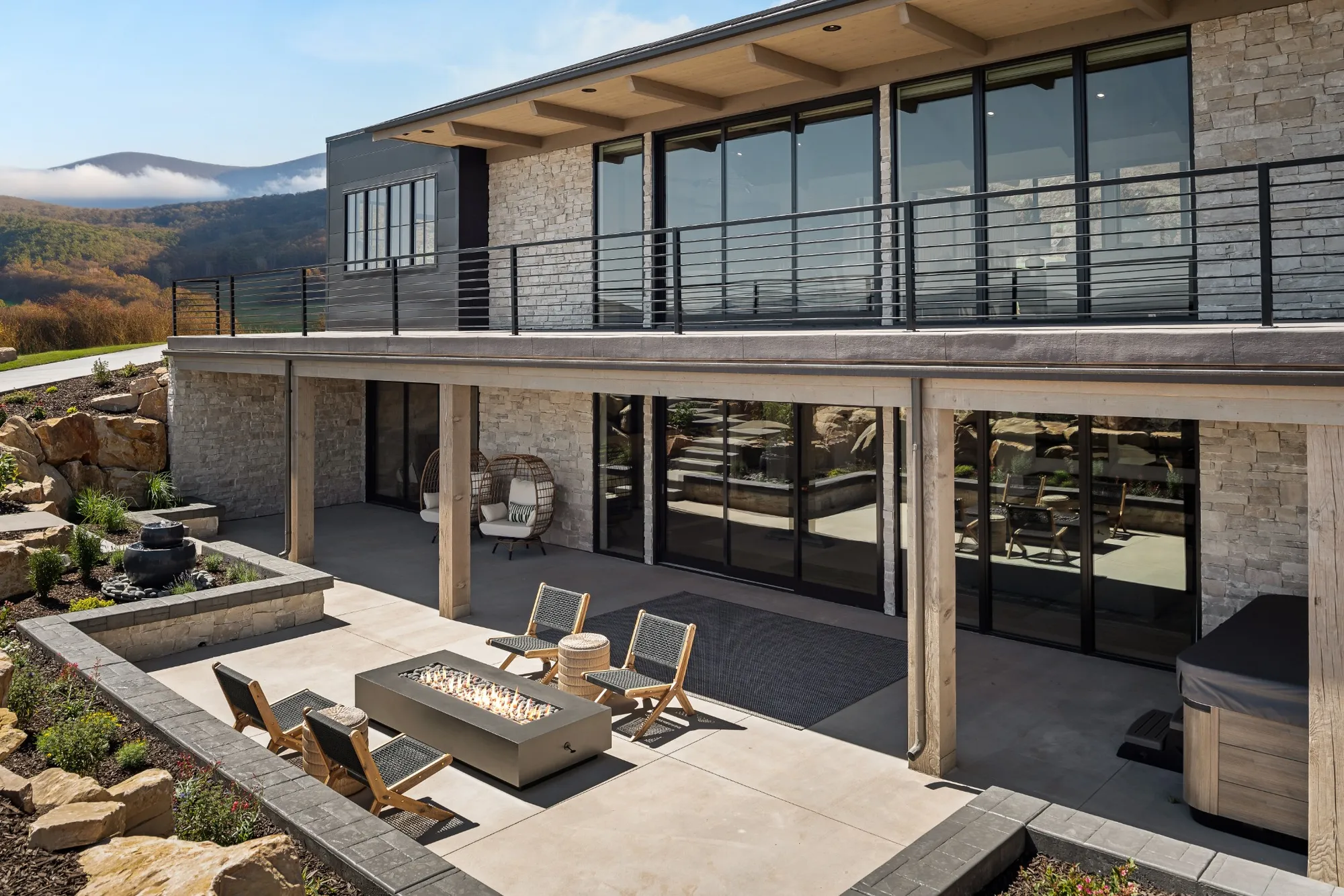 Large windows in a contemporary home showcasing expansive glass and minimalist design, creating seamless indoor–outdoor flow with modern black aluminum frames