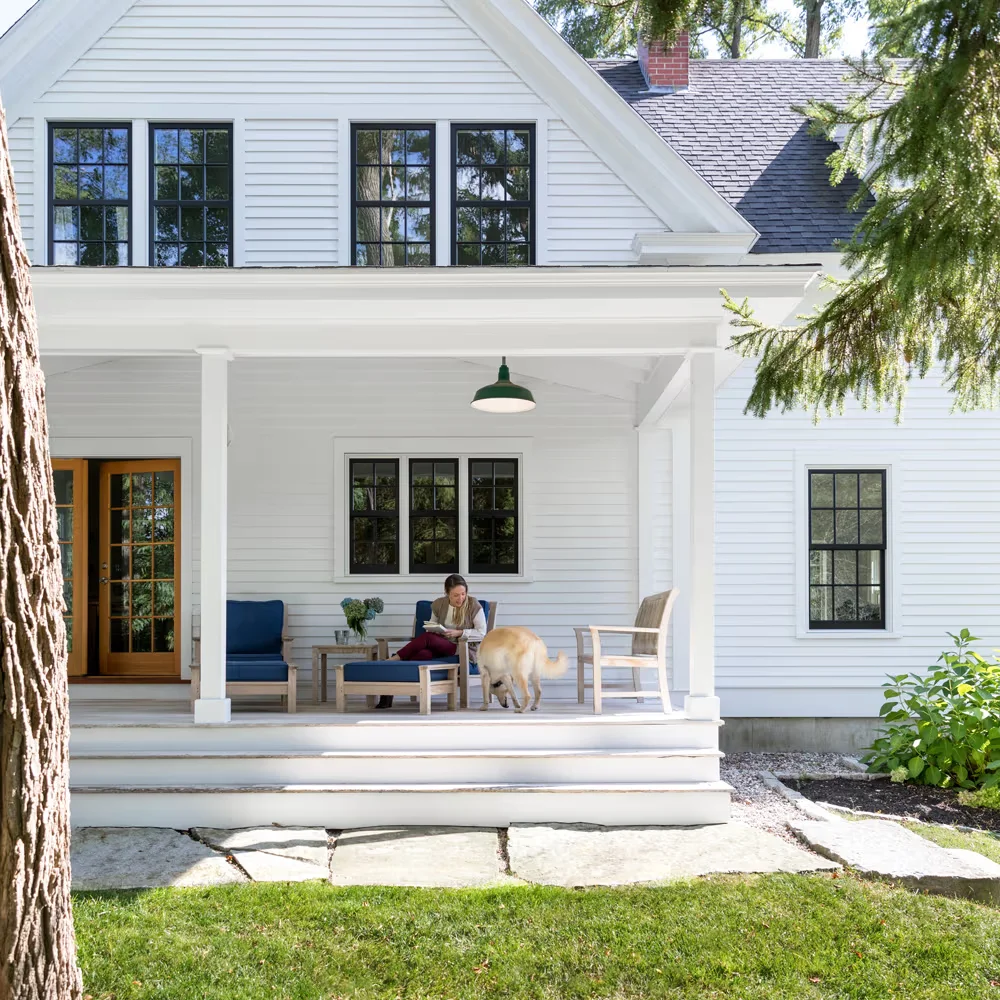 Image of a white farmhouse exterior showing marvin windows value